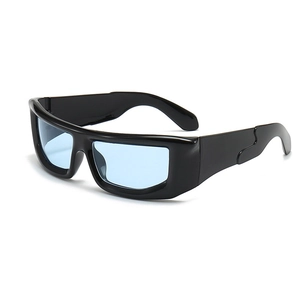 Close-up of cyber punk sunglasses with thick black frame and light blue lenses