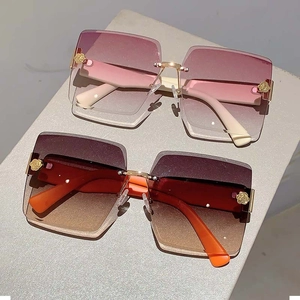 Frameless oversized gradient sunglasses with elegant gold rose flower details on temples