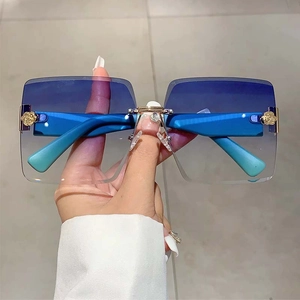 Frameless square gradient blue sunglasses with decorative gold rose metal hinge accents