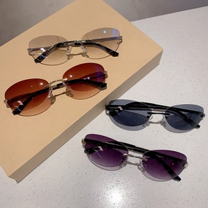 Lunettes de soleil ovales Y2K sans monture avec branches en métal et verres dégradés