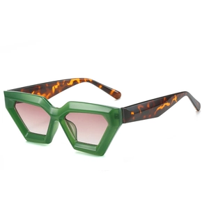 Lunettes de soleil géométriques avec monture verte, branches écaille et verres dégradés