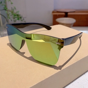 Detailed side view of rimless oversized sunglasses with gold mirrored lens and black temples