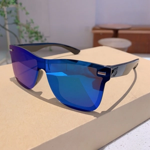 Fashionable rimless oversized shield sunglasses with blue purple mirrored lens on white box