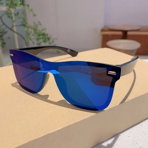Detail of fashion rimless sunglasses with blue mirrored lenses and silver accents