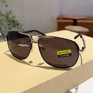 Close-up of polarized aviator sunglasses with metal frame and brown lenses for driving