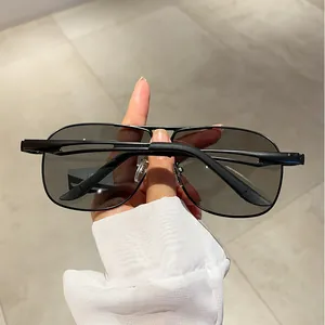 Close-up of polarized aviator sunglasses with matte black metal frame and double bridge