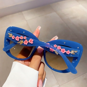 Vintage oversized cat-eye sunglasses in blue with floral enamel and crystal details
