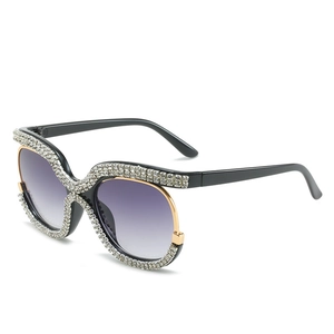 Oversized rhinestone sunglasses with black gold frame and purple gradient lenses