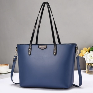 Dark blue leather tote bag with black straps and gold hardware for commute