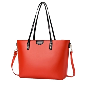 Large vintage red leather tote bag with black handles and gold logo lettering