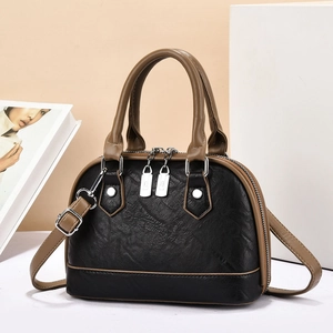 Fashionable black and brown contrast shell bag with wrinkled faux leather and silver zipper