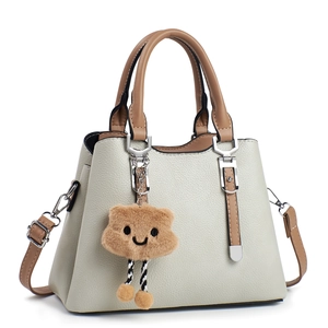 Chic beige and brown crossbody handbag with lychee pattern leather and cute bear charm