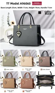 Detailed view of woven tote bag dimensions 25x11x19cm with heart pearl charm and gold hardware