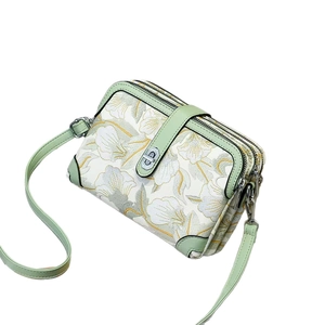 Mini floral embroidered crossbody bag with three zipper layers and green leather strap