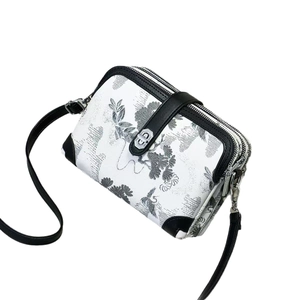 Chinese style floral print crossbody bag with white canvas and black leather trim