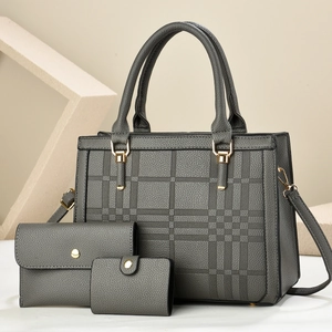 Three-piece dark grey crossbody set with checkered embossing and gold hardware