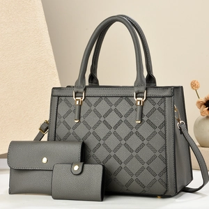 Three-piece dark grey pebble leather tote set with geometric pattern and gold hardware