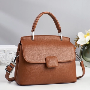 Brown litchi grain leather trapezoid handbag with top handle and silver hardware