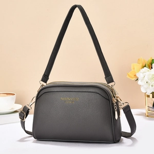 Deep gray litchi texture shell shoulder bag with golden hardware and multi-zipper design