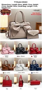 Detail view of crocodile-patterned patent leather tote and clutch set with large bow detail