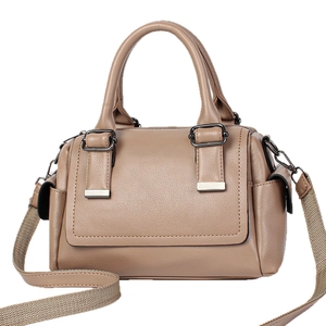 Large solid color leather tote bag with wide strap and metallic buckles for women