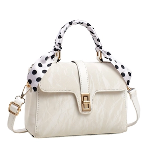 Chic cream-white crossbody bag with marble texture and trendy polka dot scarf handle