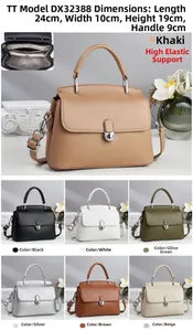 Litchi pattern leather handbag with wide shoulder strap and interior zipper compartment