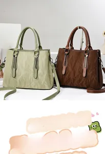Close-up of crumpled texture detail on light green and dark brown tote bags