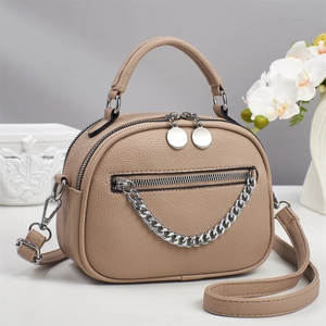 Beige lychee pattern crossbody bag with silver chain detail and dual zipper compartments