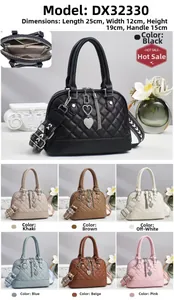 Quilted shell-shaped tote bag with heart tassel detail and ethnic style woven strap