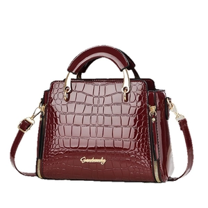 Glossy deep red crocodile pattern leather handbag with gold logo and shoulder strap