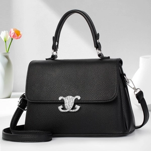 Chic black litchi pattern leather shoulder bag with decorative diamond metal buckle detail