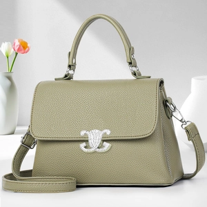 Minimalist olive green pebble leather crossbody bag with silver crystal buckle and top handle
