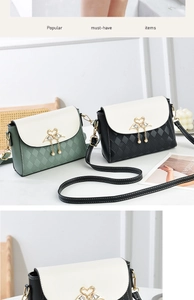 Detail view of contrast color crossbody bag with quilted pattern and pearl tassel metal clasp
