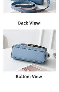 Detailed back and quilted bottom view of light blue crossbody bag with white stitching