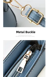 Detail of light gold hardware clasp and zipper on morandi blue leather crossbody bag