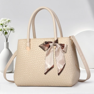 Elegant beige quilted handbag with silk scarf handle and detachable crossbody strap