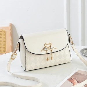 Elegant cream quilted square crossbody bag with gold swan lock and pearl pendant