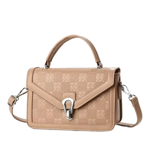 Beige crocodile embossed handbag for women with silver buckle and shoulder strap