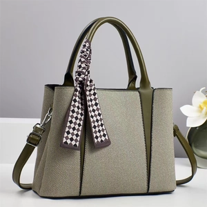 Canvas and green leather tote bag with silk scarf decoration and shoulder strap