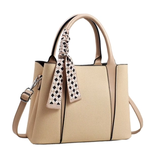 Chic beige and brown patchwork tote bag with decorative scarf and shoulder strap