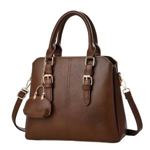 Dark brown pebble leather tote bag with gold hardware and mini round charm accessory