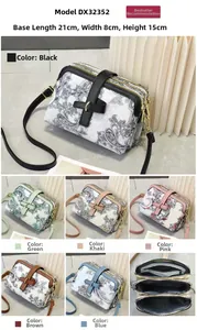 Detailed view of women's paisley crossbody bag showing triple zipper compartments and 21cm size