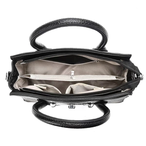 Interior view of black pebbled leather crossbody bag showing multi-compartment lining
