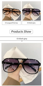 Detail view of retro oval sunglasses in leopard print and classic black frames