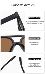 Close-up of black oval sunglasses featuring sturdy hinges and brown lenses