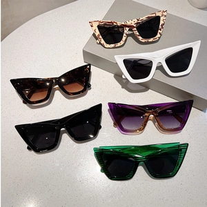 Detailed close-up of six trendy cat eye sunglasses in various colors and patterns