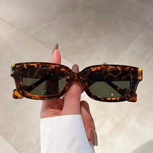 Chic retro square tortoiseshell sunglasses with dark lenses for a trendy street style look