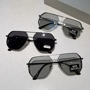 Close-up of photochromic polarized pilot sunglasses with slim metal frames and model DYD 5087