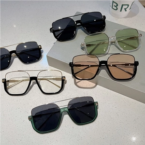 Collection of oversized half-frame sunglasses with various tinted lenses and dual-bridge frames